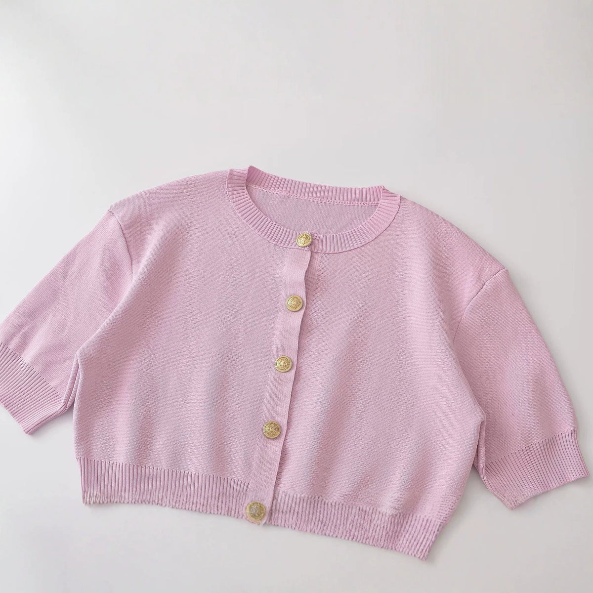 Short sleeved round neck knitted sweater with shoulder pads for women