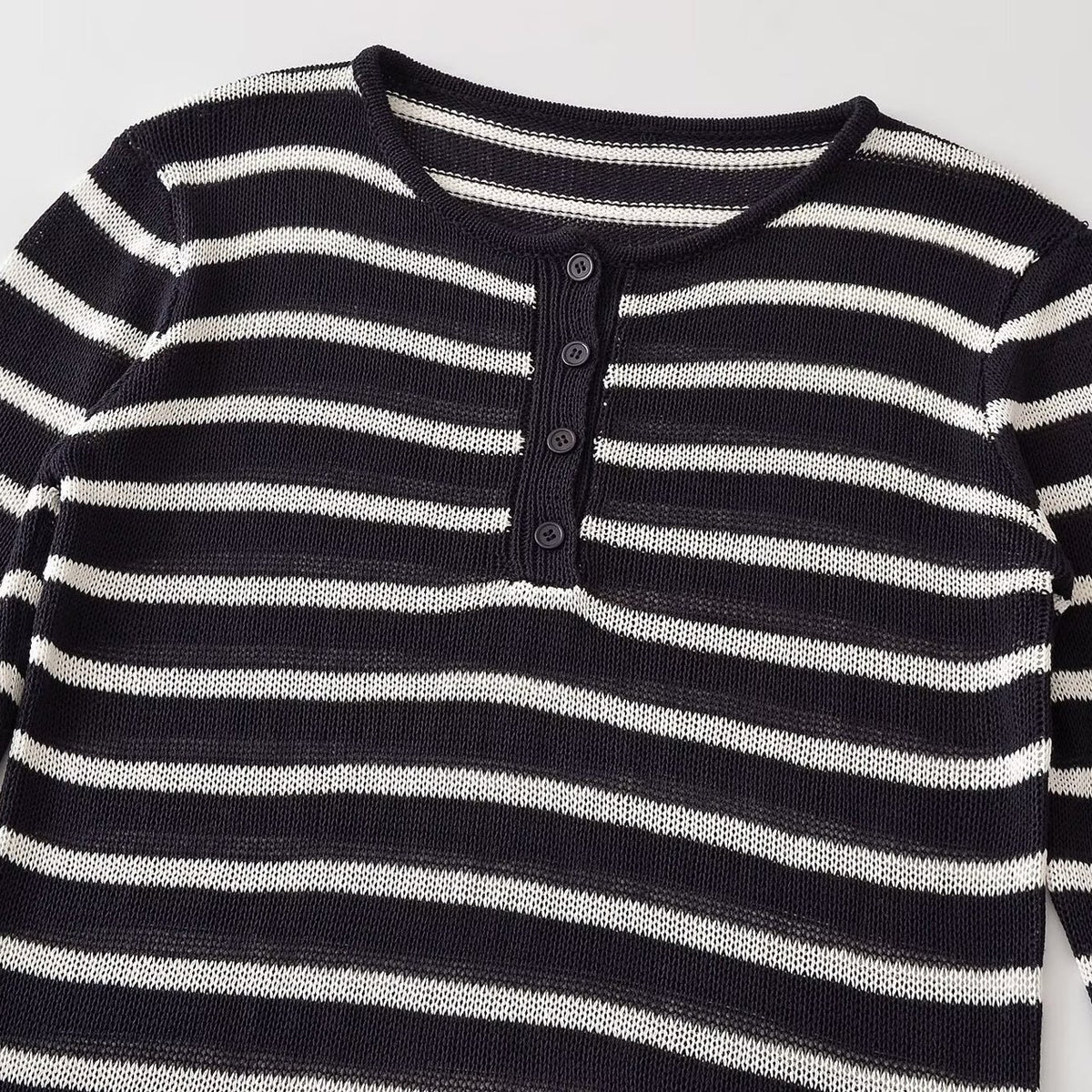 Casual and minimalist long sleeved round neck striped knitted sweater for women